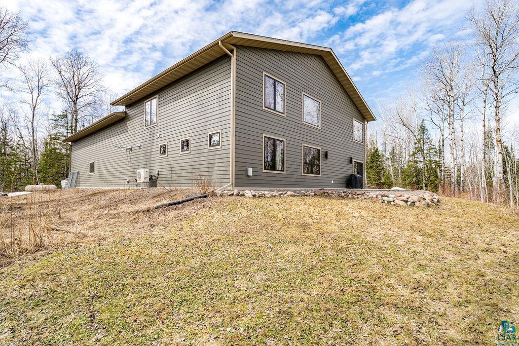 5174 Upper Peterson Road Duluth, MN 55804 - Photo 26 of 42 View of side of home featuring a lawn
