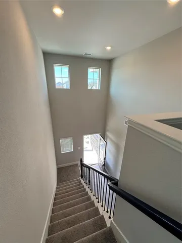 a view of a hallway with stairs