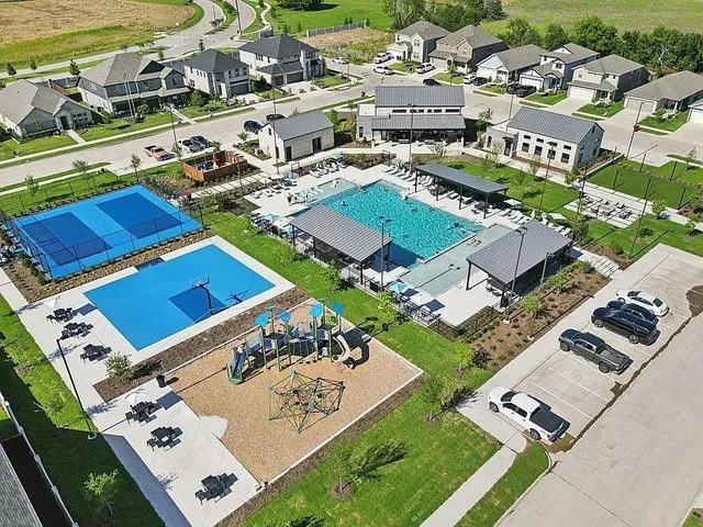 an aerial view of a house with a garden