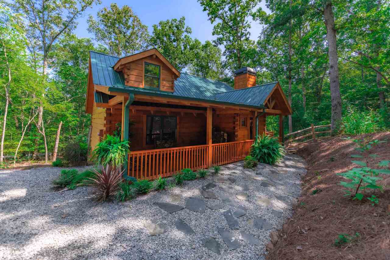 18 Amanda Court Blue Ridge, GA 30513 - Photo 1 of 1 a front view of a house with garden