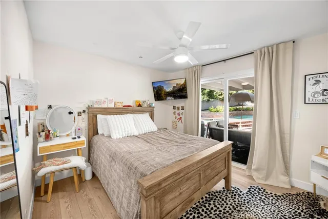 a bedroom with a bed and a view of kitchen