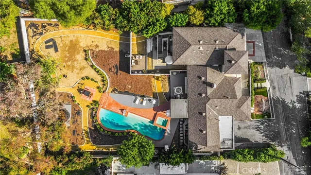 an aerial view of a residential apartment building with a yard