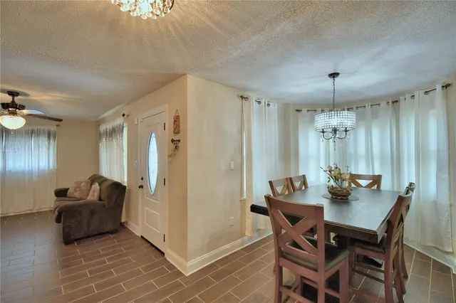 a view of a hallway view with wooden floor and staircase
