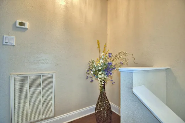 a spacious bathroom with a granite countertop sink toilet and shower