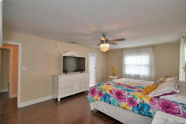 a front view of house with yard and trees