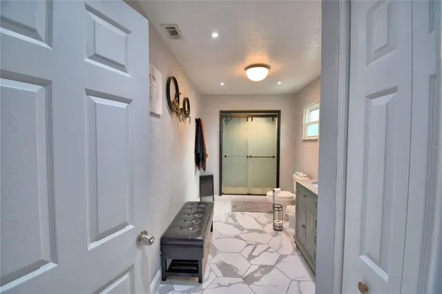 an aerial view of a house with outdoor space