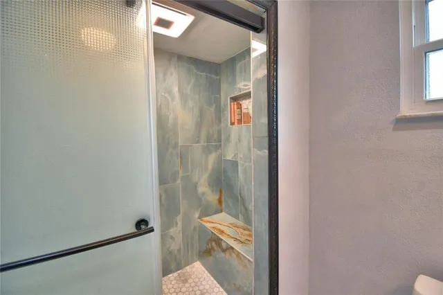 an aerial view of a house with a yard