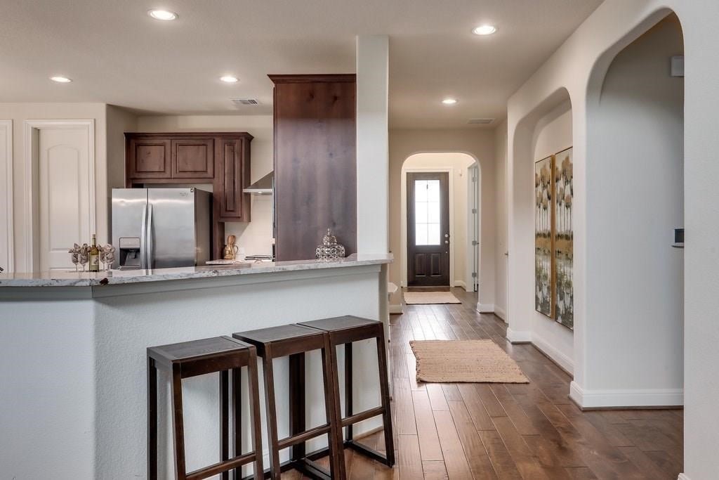 10825 Ballard Path Austin, TX 78717 - Photo 9 of 39 a kitchen with stainless steel appliances a refrigerator and microwave