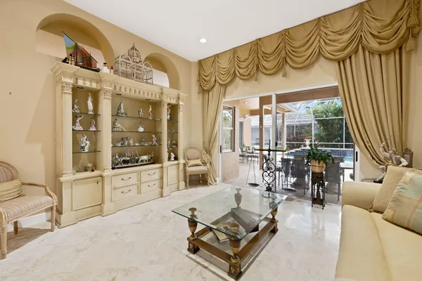 a kitchen with stainless steel appliances granite countertop a refrigerator a stove and a sink