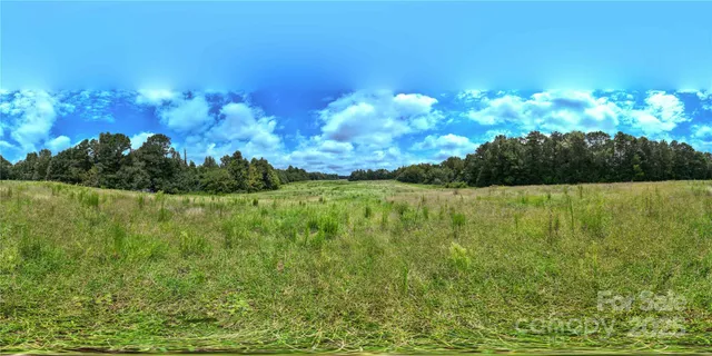 a view of lake with green space