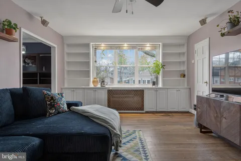 a bedroom with a large bed and a large window