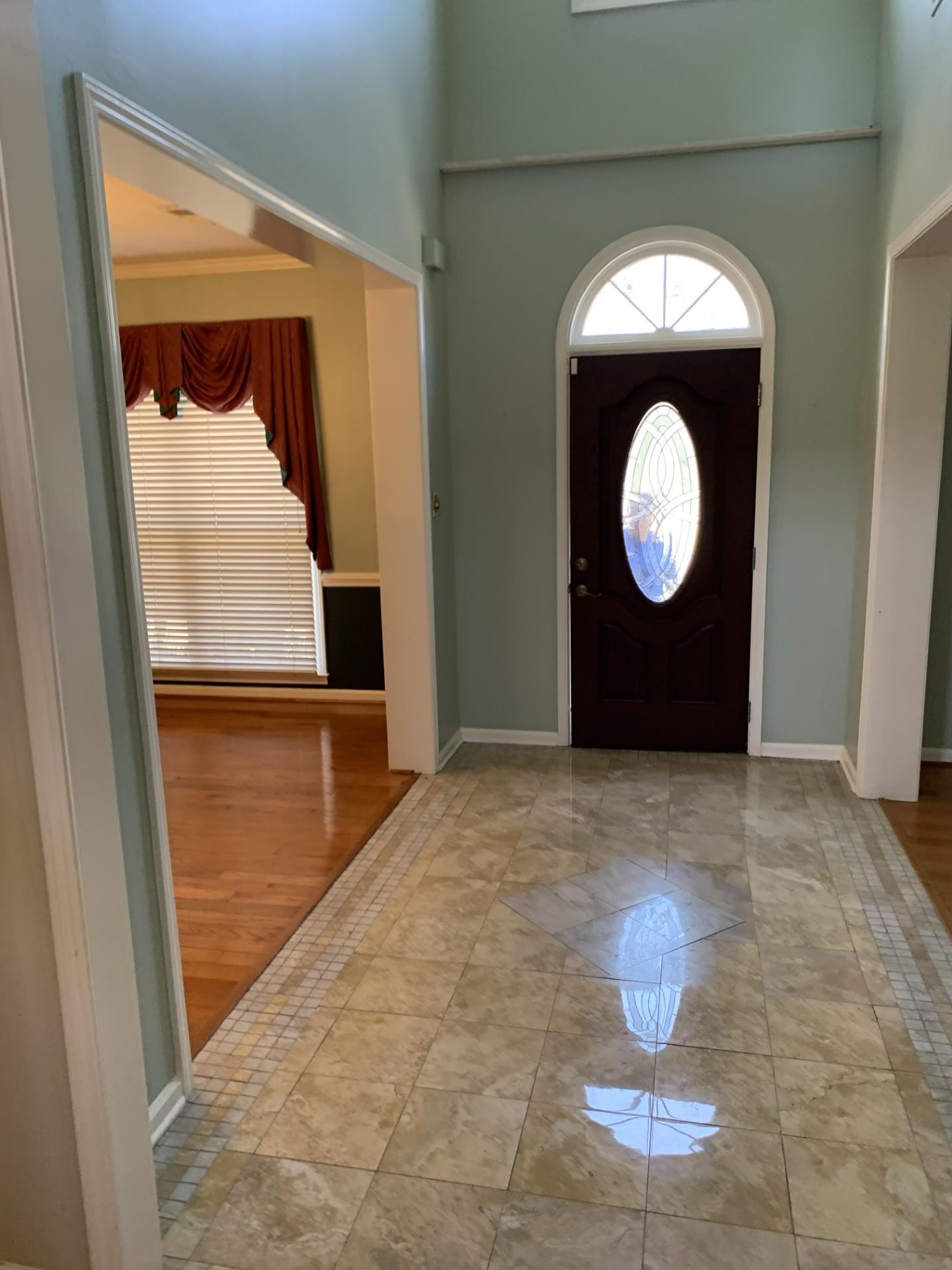 8717 Dexter Road Memphis, TN 38016 - Photo 4 of 12 Foyer featuring a wealth of natural light, a towering ceiling, and baseboards
