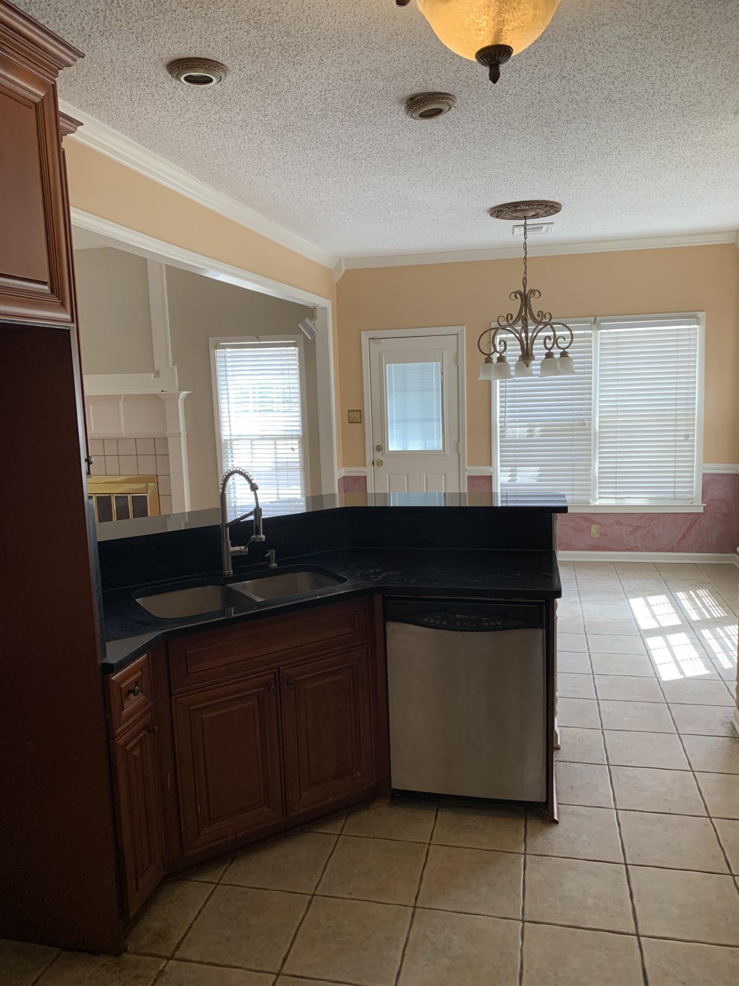 8717 Dexter Road Memphis, TN 38016 - Photo 8 of 12 Kitchen featuring bar overlooking eating area.