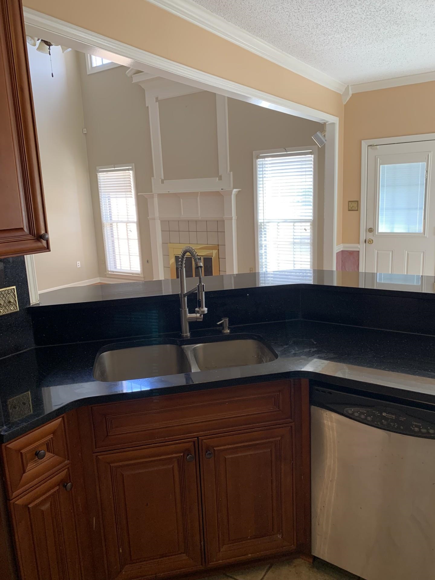 8717 Dexter Road Memphis, TN 38016 - Photo 9 of 12 Kitchen featuring a sink, a healthy amount of sunlight,