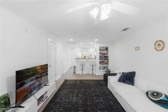 a large white kitchen with a large window