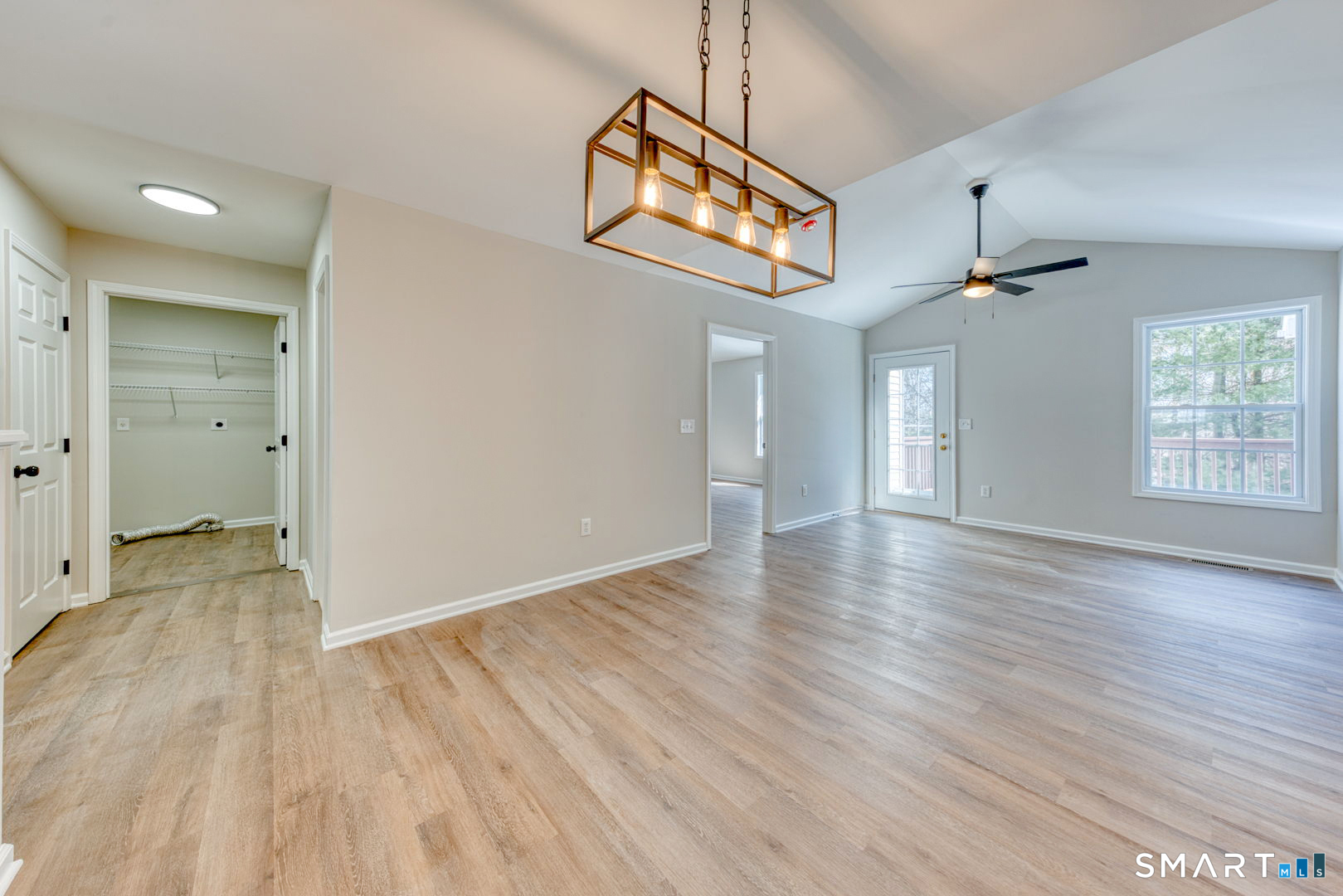 159 Jennifer Lane, Unit 159 Newtown, CT 06482 - Photo 10 of 28 wooden floor in an empty room with a window