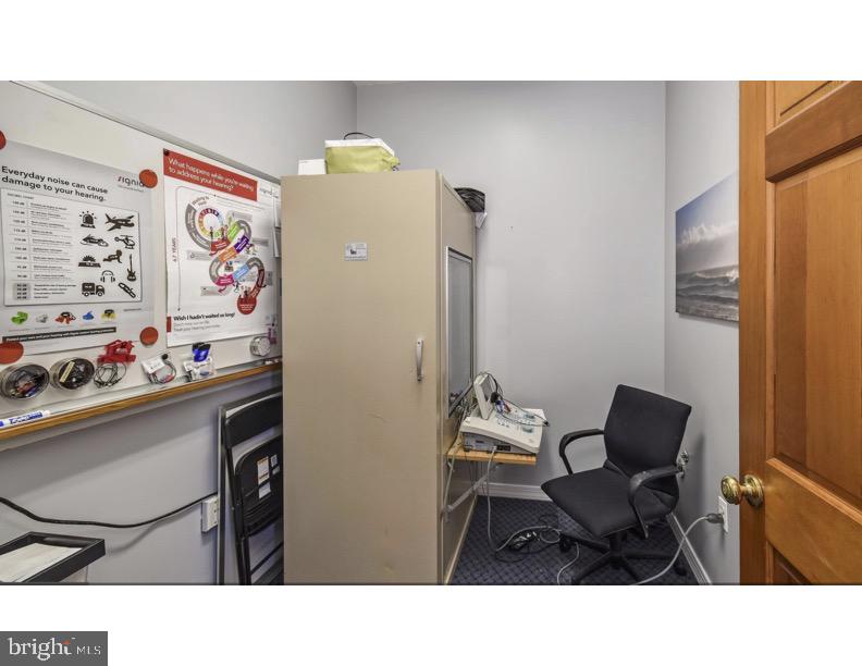 7928 Ridge Avenue Philadelphia, PA 19128 - Photo 18 of 38 a kitchen with a refrigerator and cabinets