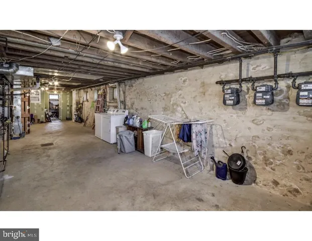 a room with lots of furniture and clutter