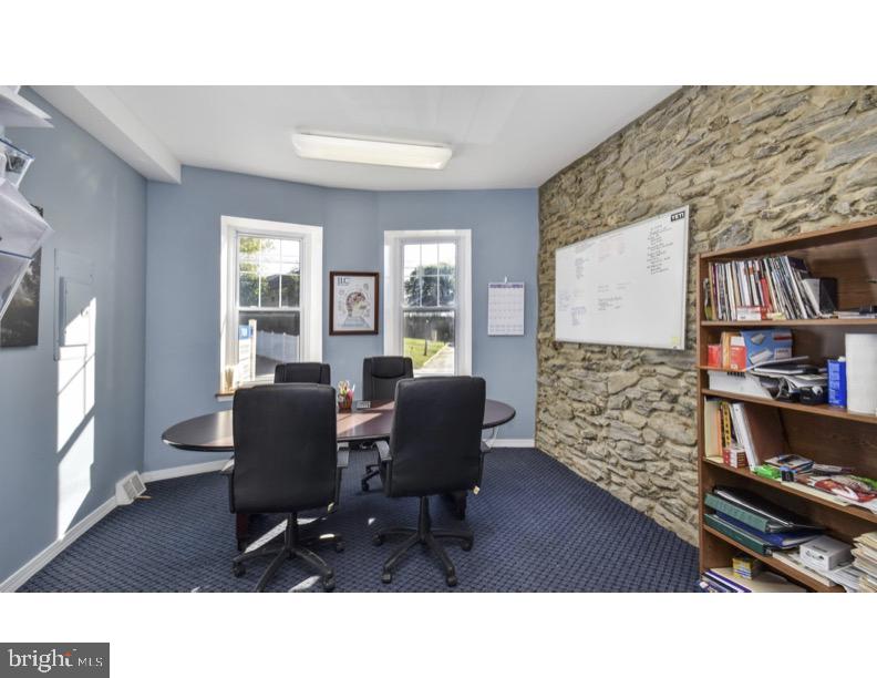 7928 Ridge Avenue Philadelphia, PA 19128 - Photo 3 of 38 a living room with furniture and a window