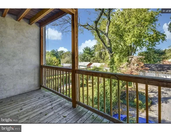 a view of balcony with wooden floor