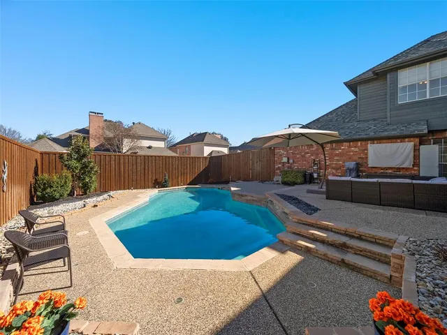 a view of entryway livingroom and hall with wooden floor