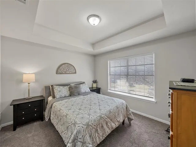 a bedroom with a bed and a desk