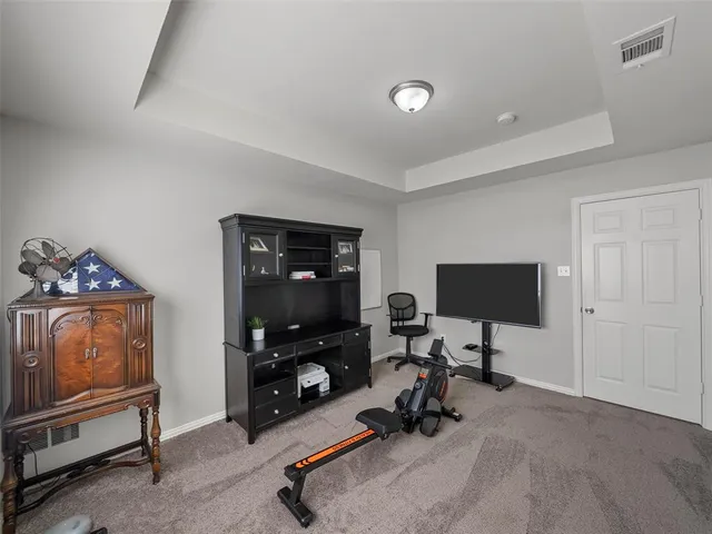 a bathroom with a sink vanity mirror and toilet