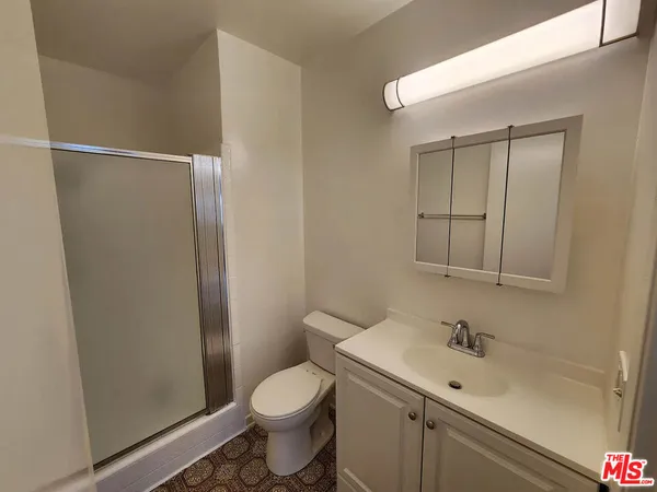 a view of hallway with wooden floor