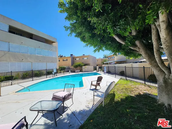 a view of swimming pool with seating space