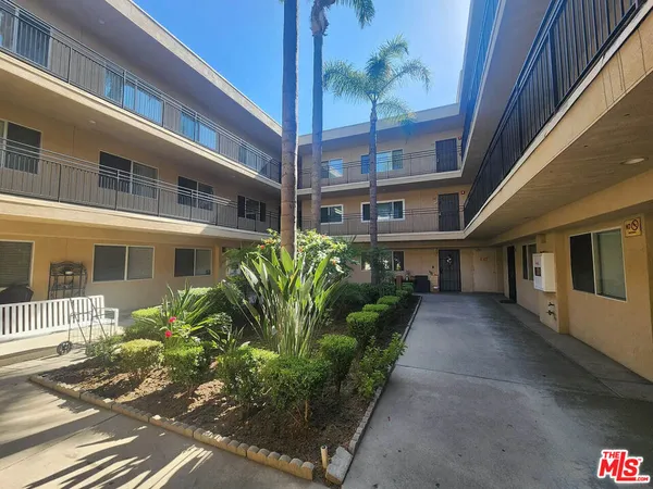 a view of a house with a flower garden