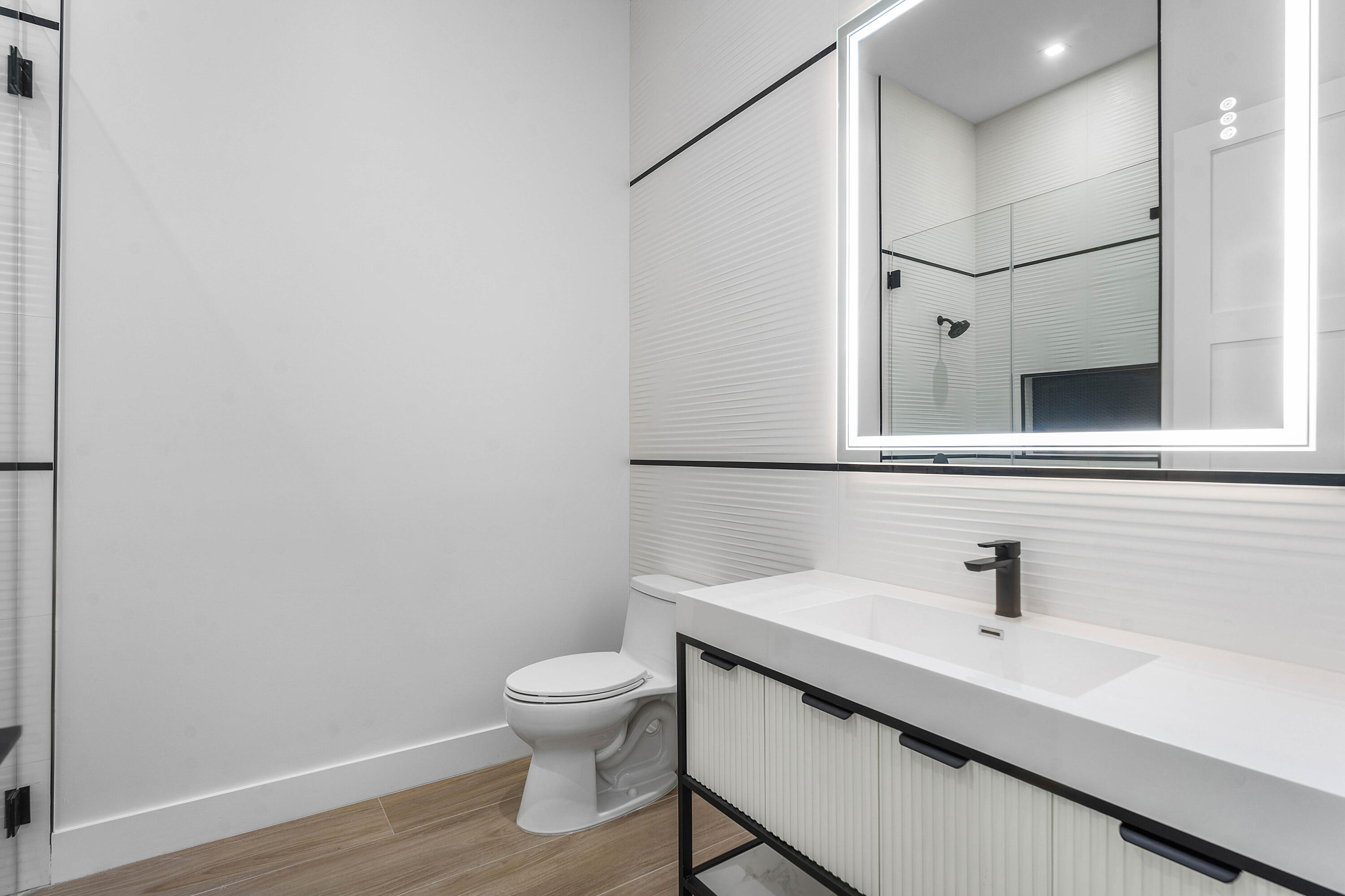 5701 Old Orange Road Jupiter, FL 33458 - Photo 29 of 46 a bathroom with a sink a toilet and mirror