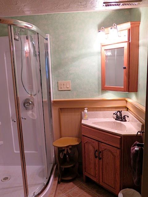 2453 Ridge Road McKeesport, PA 15135 - Photo 17 of 19 Second full bath is located off the game room. The corner shower and sink make good use of this bathroom space.