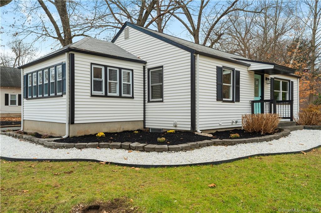 174 Spring Street Windsor Locks, CT 06096 - Photo 1 of 1 a front view of a house with a yard