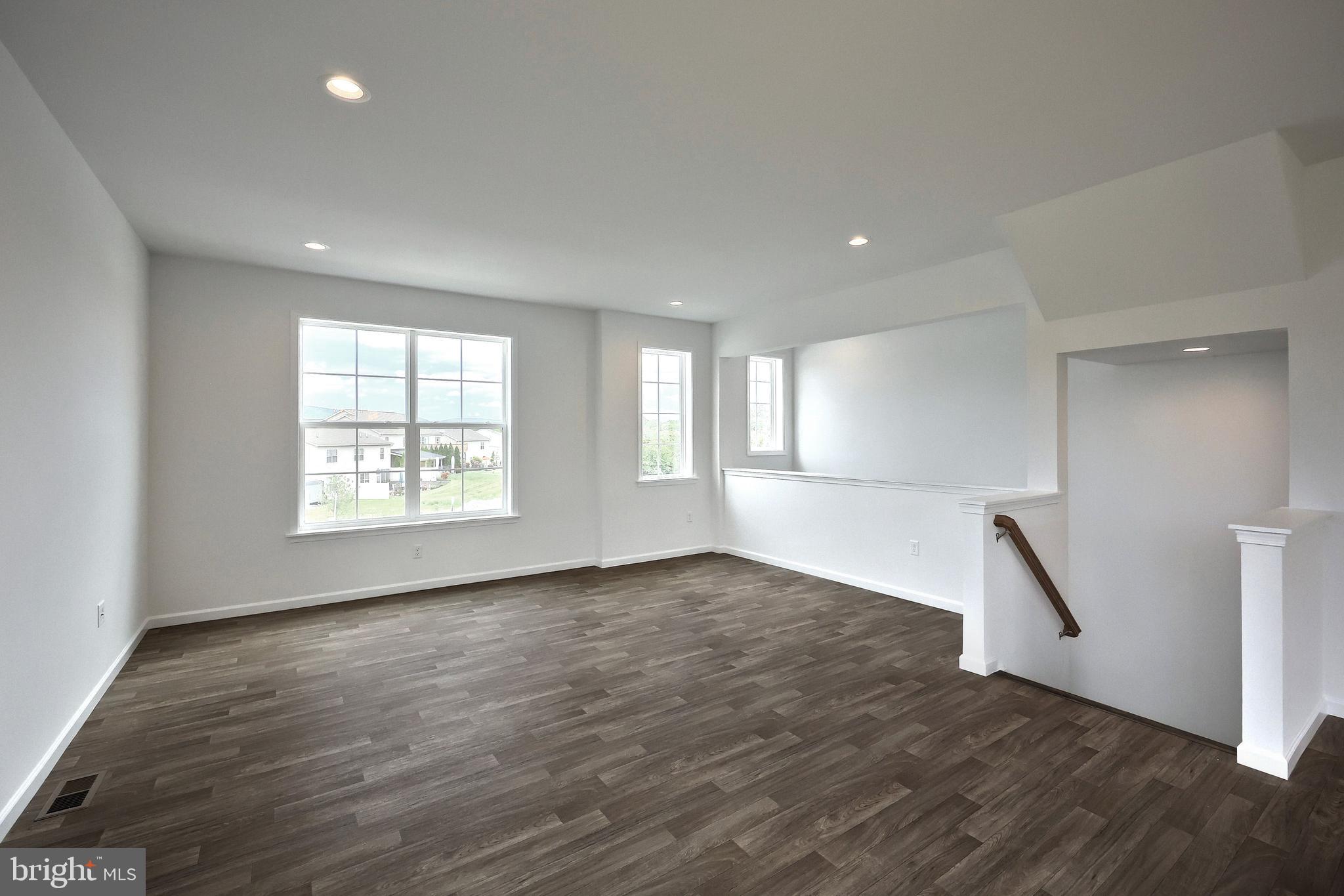 63 Glenn View Carlisle, PA 17013 - Photo 11 of 20 an empty room with wooden floor and a window