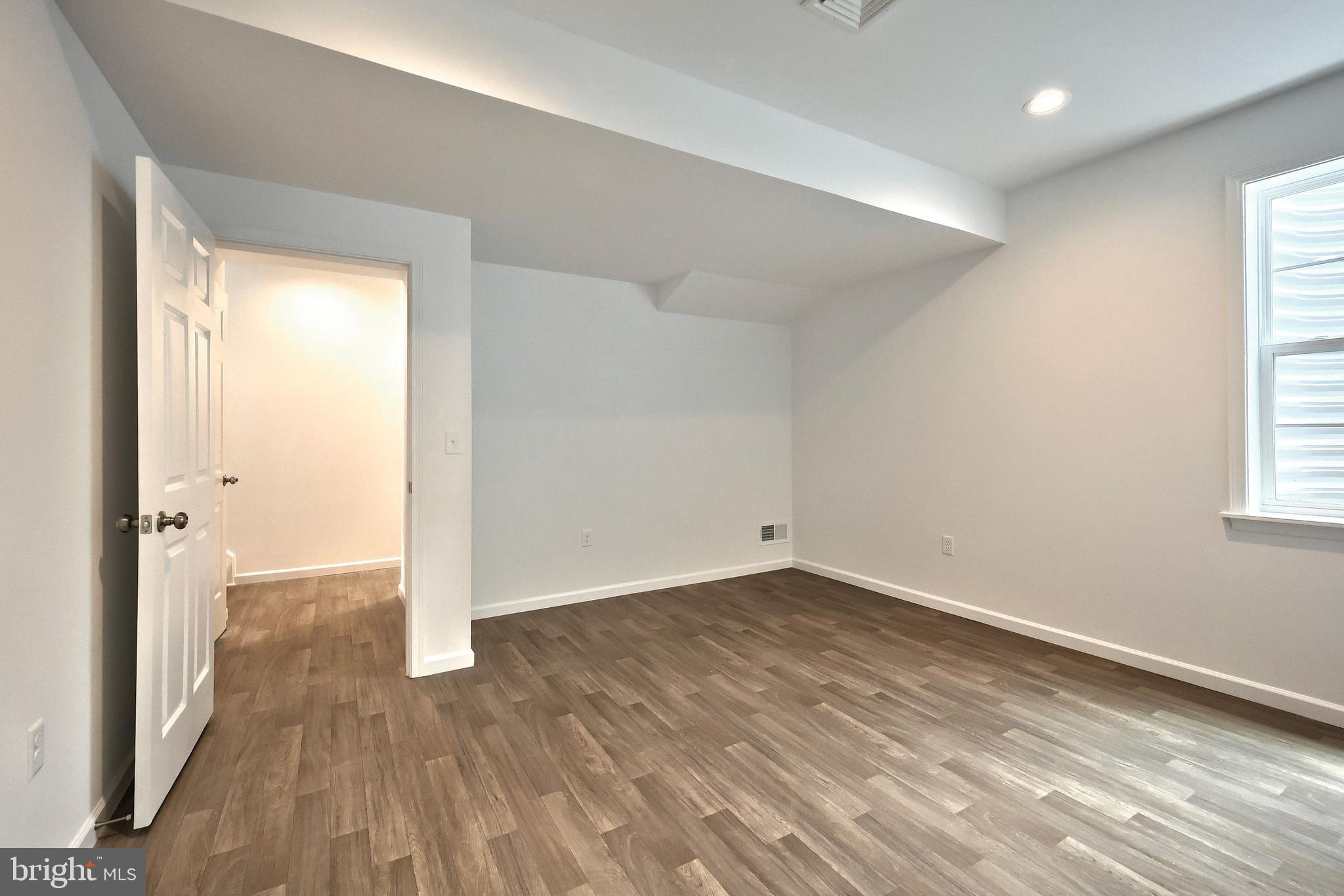 63 Glenn View Carlisle, PA 17013 - Photo 19 of 20 an empty room with wooden floor and windows