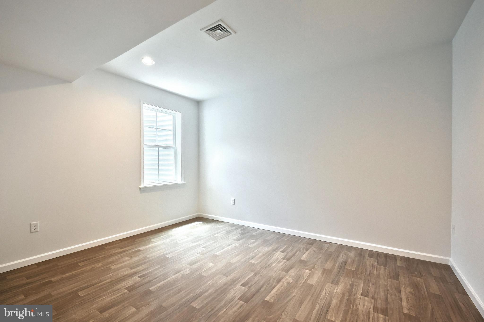 63 Glenn View Carlisle, PA 17013 - Photo 20 of 20 an empty room with wooden floor and windows