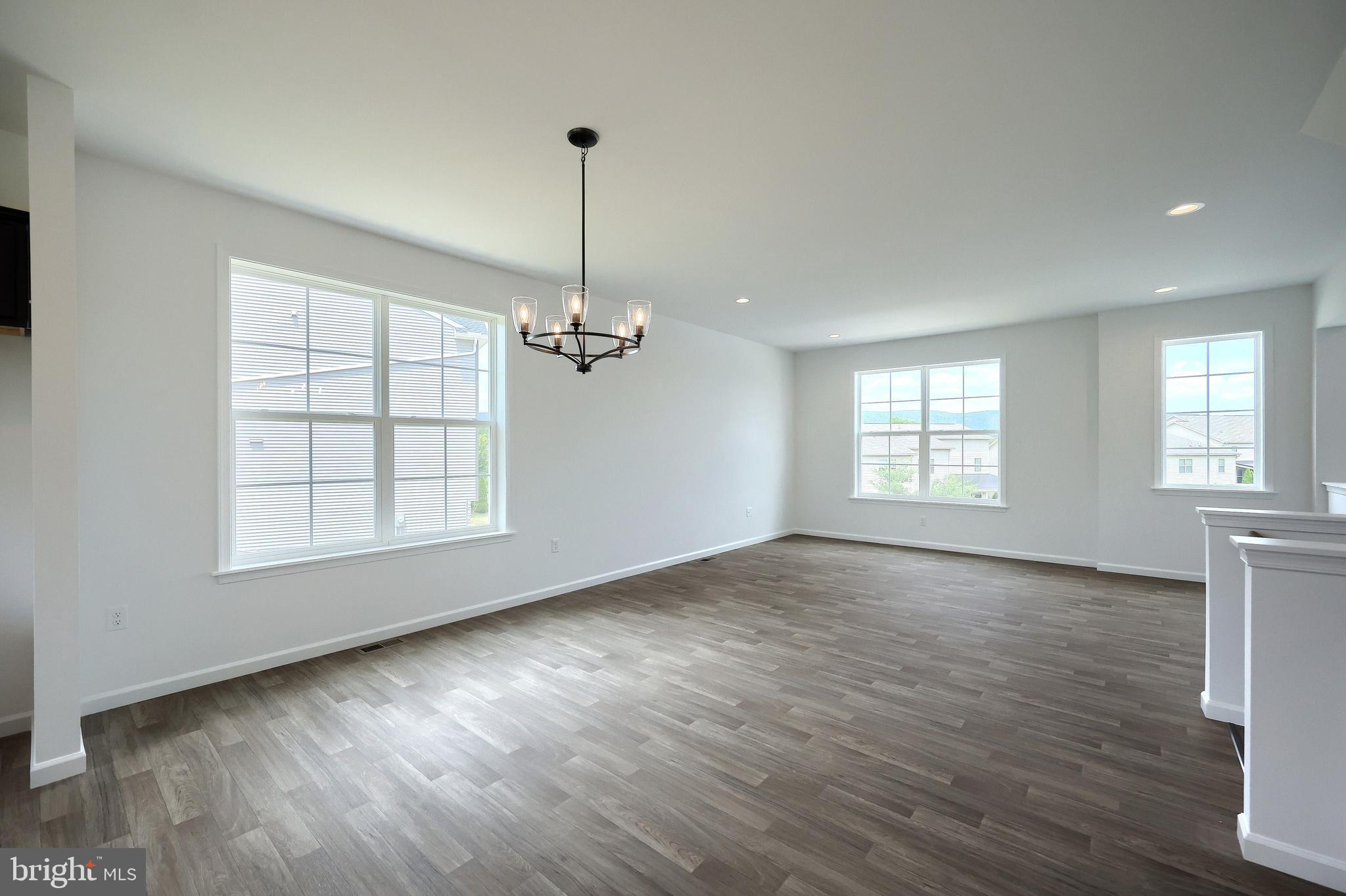 63 Glenn View Carlisle, PA 17013 - Photo 10 of 20 a view of an empty room with a window and wooden floor