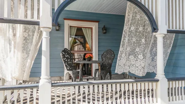 a view of a balcony with chairs