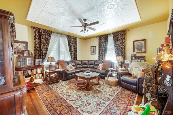 a bed room with a bed mirror and a couch