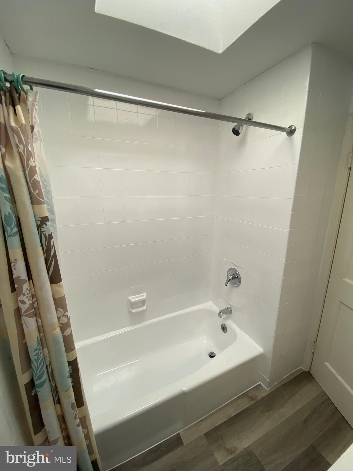 338 Gusryan Street Baltimore, MD 21224 - Photo 14 of 20 a bathroom with a shower and a bath tub