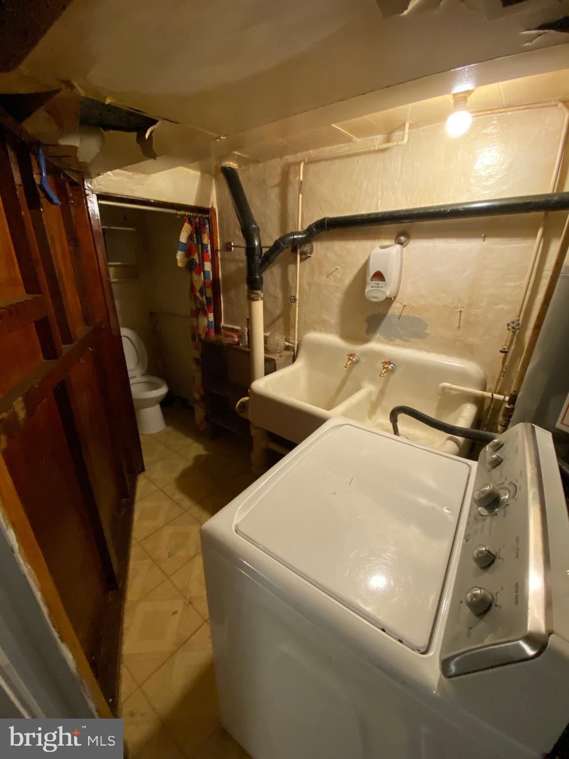 338 Gusryan Street Baltimore, MD 21224 - Photo 18 of 20 a utility room with dryer and washer
