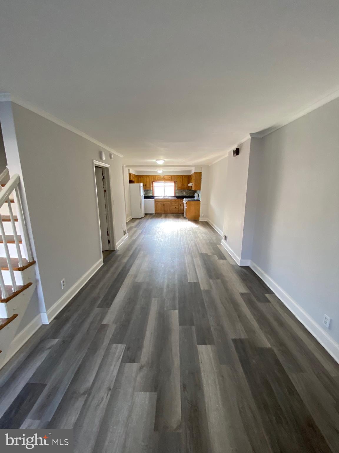 338 Gusryan Street Baltimore, MD 21224 - Photo 3 of 20 a view of empty room with wooden floor