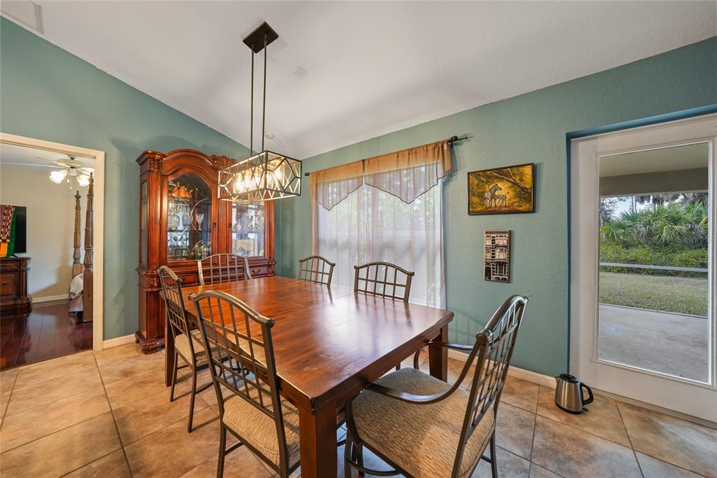 1291 Impala Street North Port, FL 34288 - Photo 12 of 44 a view of a dining room with furniture window and outside view
