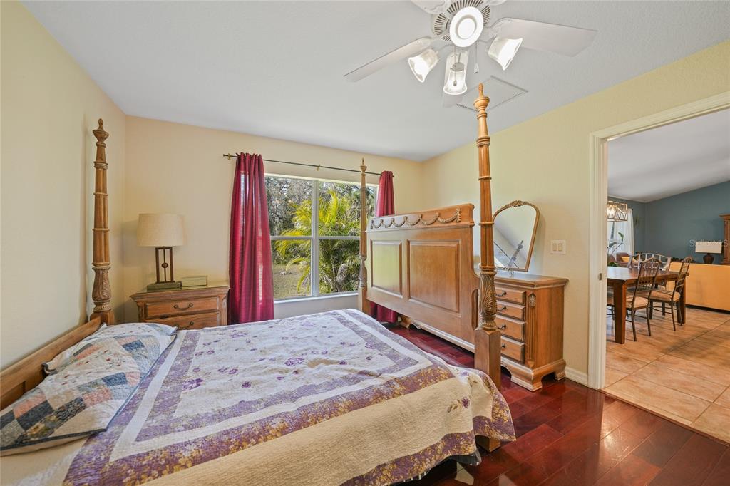 1291 Impala Street North Port, FL 34288 - Photo 20 of 44 a bedroom with a bed dresser and a large window