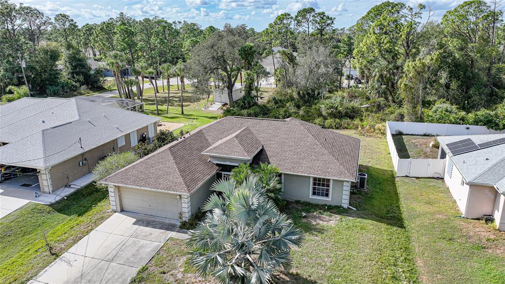 1291 Impala Street North Port, FL 34288 - Photo 2 of 44 an aerial view of a house with a big yard