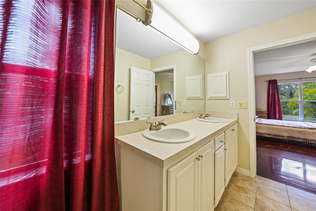 1291 Impala Street North Port, FL 34288 - Photo 23 of 44 a bathroom with a sink and a mirror