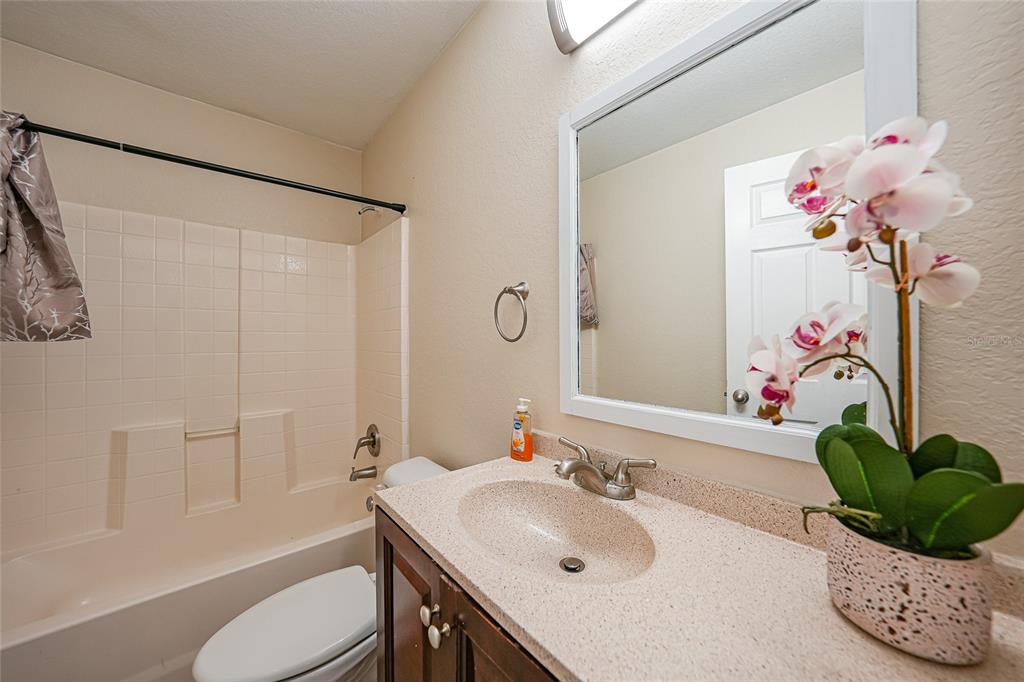 1291 Impala Street North Port, FL 34288 - Photo 26 of 44 a bathroom with a sink mirror and toilet