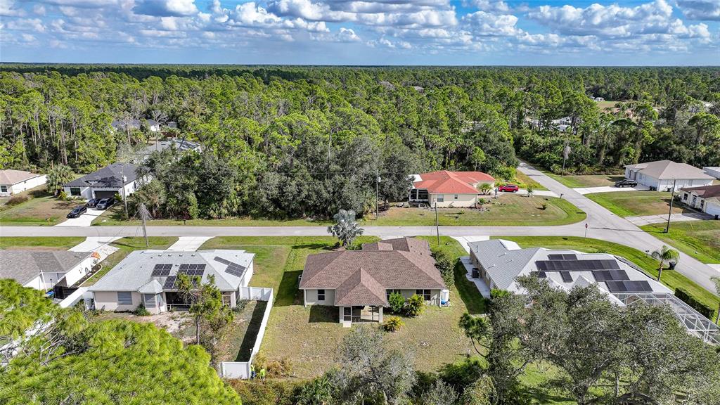 1291 Impala Street North Port, FL 34288 - Photo 34 of 44 an aerial view of a house with a swimming pool