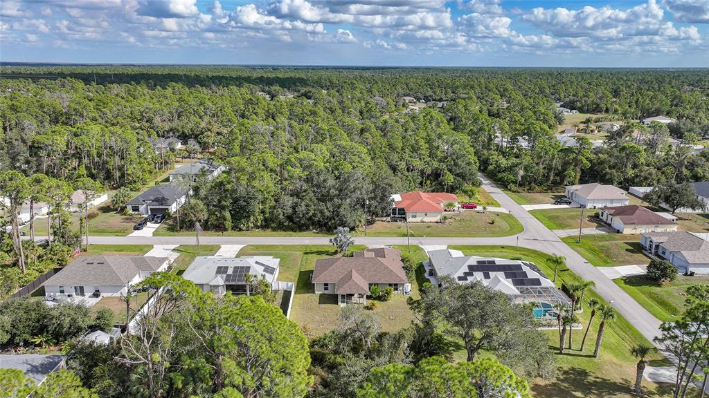 1291 Impala Street North Port, FL 34288 - Photo 40 of 44 an aerial view of a house with a yard basket ball court and outdoor seating