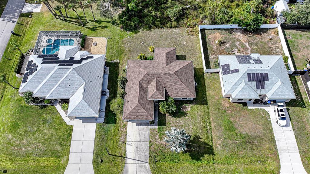 1291 Impala Street North Port, FL 34288 - Photo 4 of 44 an aerial view of residential house with outdoor space and parking